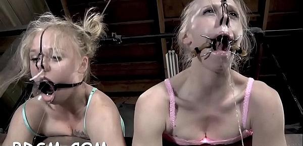  Gagged and tied up beauty gets her clits gratified